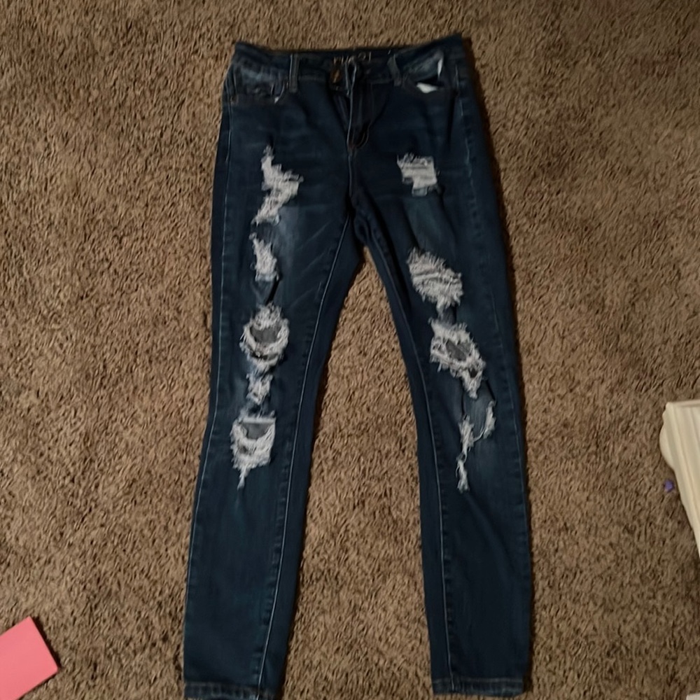 Woman’s jeans distressed high rise size 8